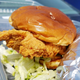Chili's chicken sandwich sitting in to-go container